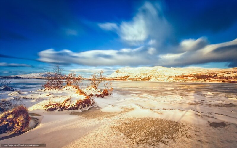 Frozen lake under blue sky