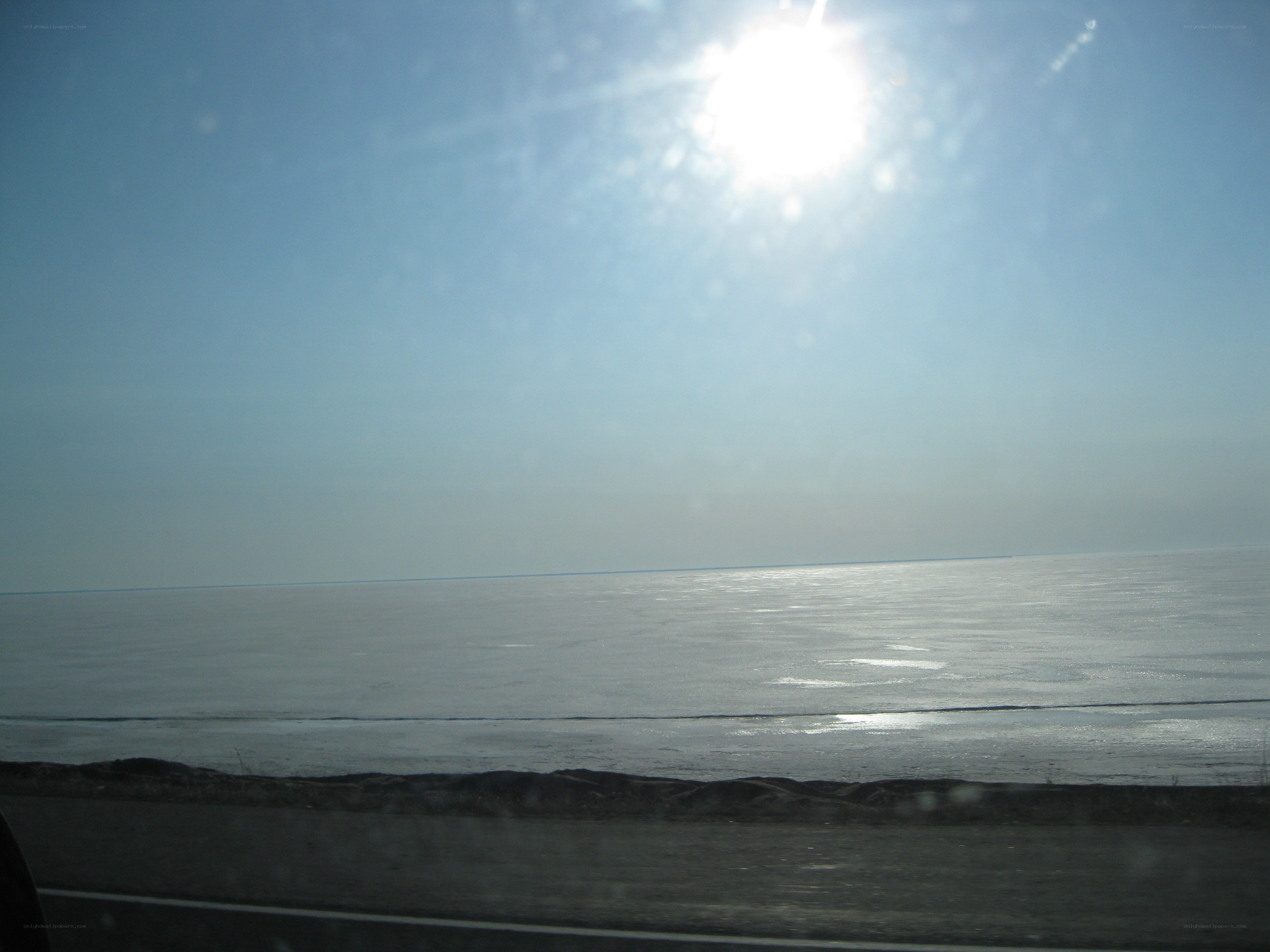 frozen lake under bright sun