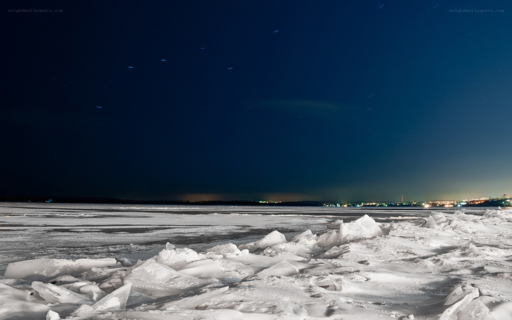 Frozen lake under starry night