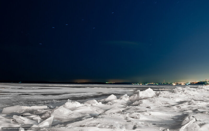 Frozen lake under starry sky