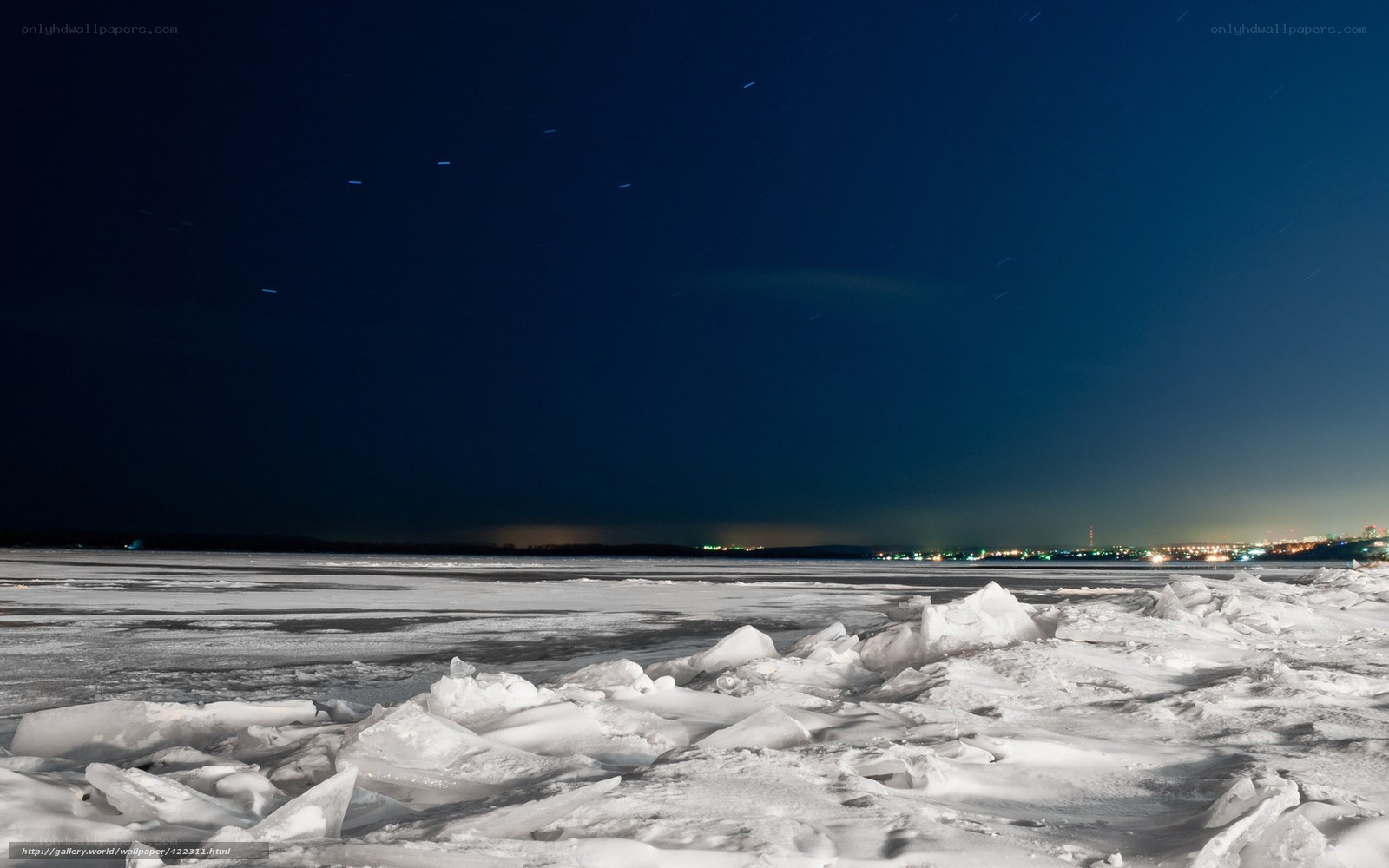 Frozen lake under starry sky