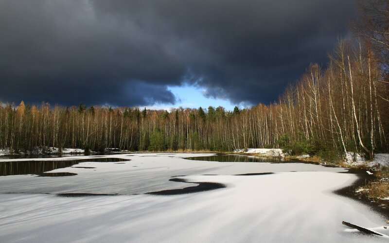 Frozen lake under stormy sky