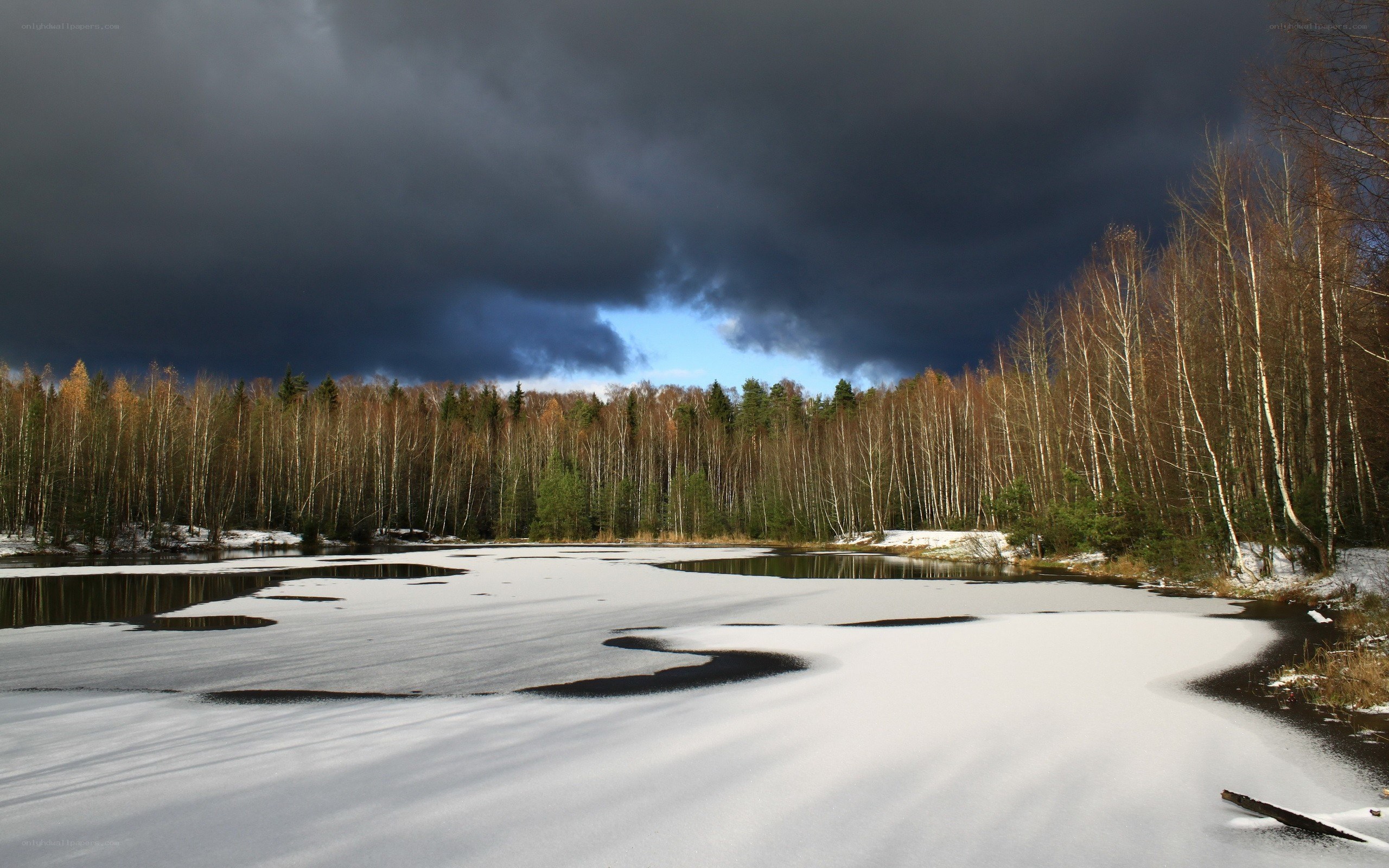 Frozen lake under stormy sky