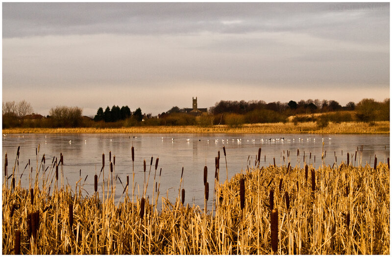 frozen lake with church in distance