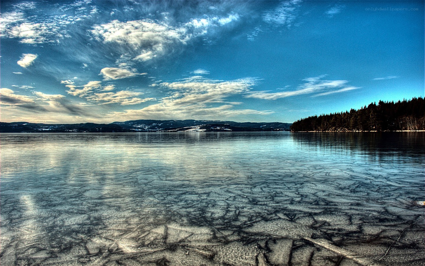 Frozen lake with cracked ice