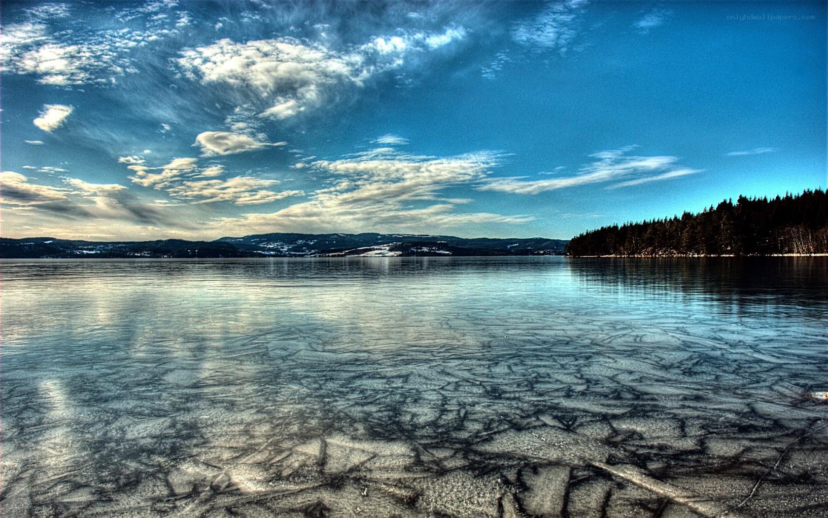 Frozen lake with cracked ice