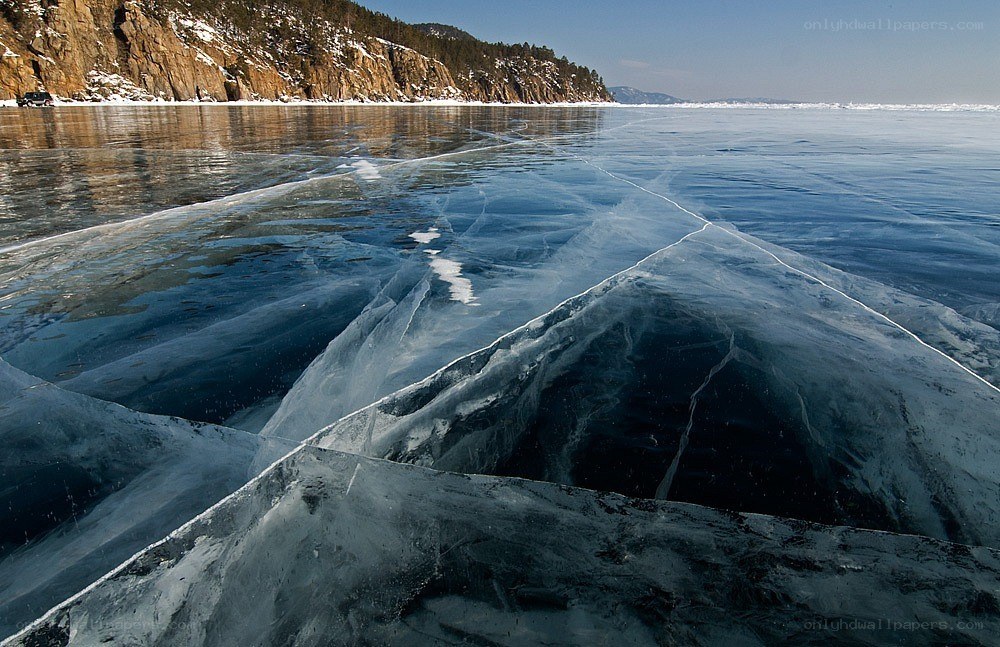 Frozen lake with cracked ice