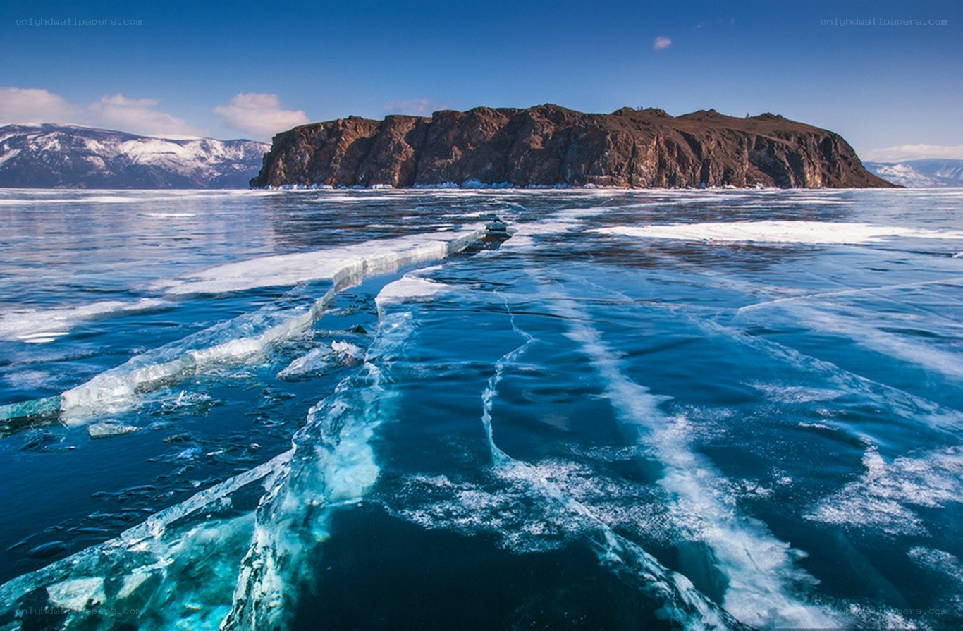 Frozen lake with ice cracks