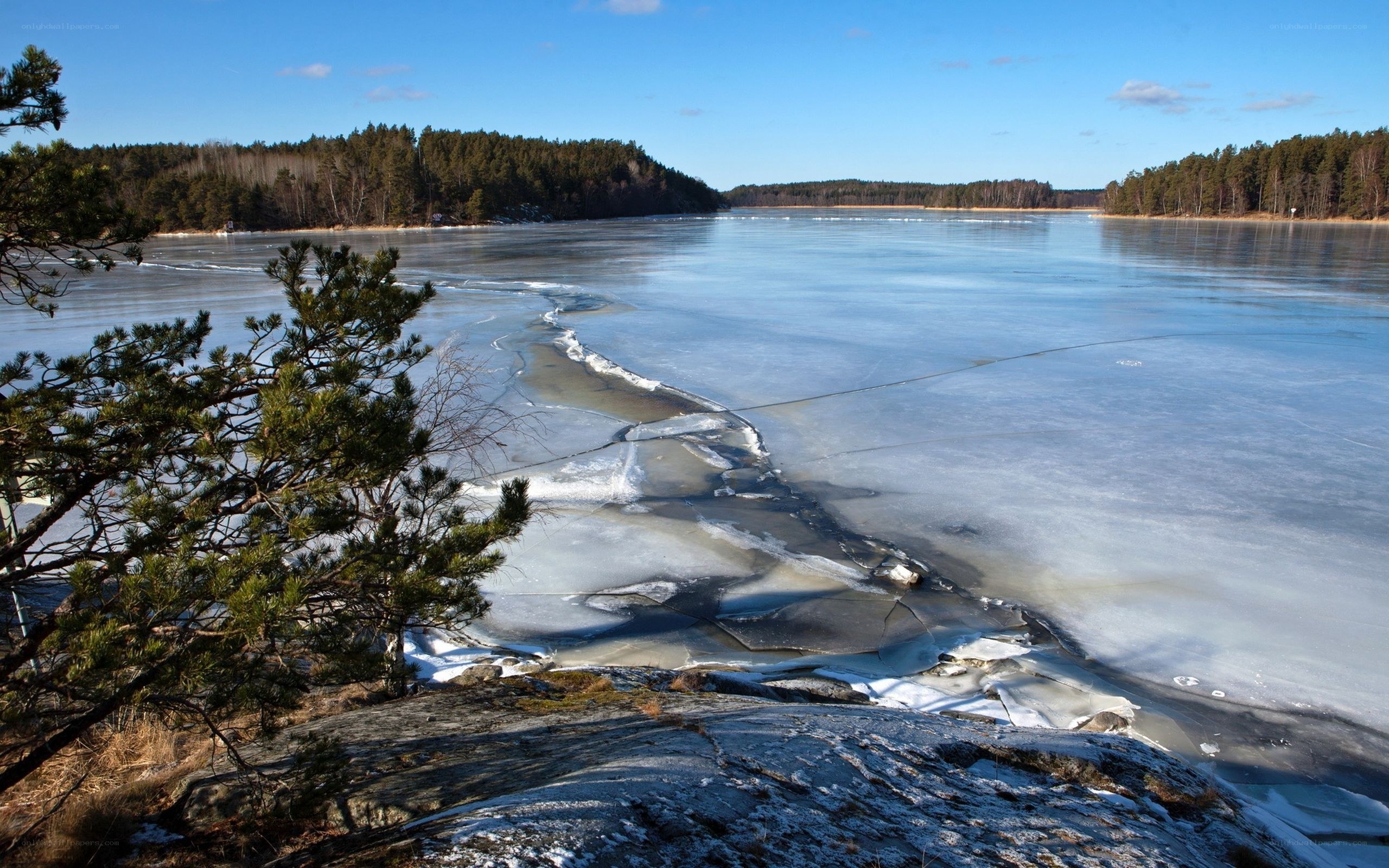 Frozen lake with ice cracks