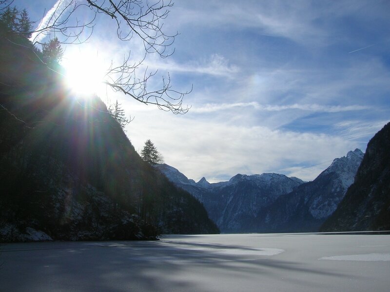 frozen lake with mountain backdrop