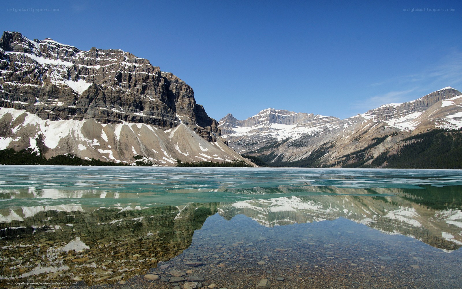 Frozen lake with mountain reflection