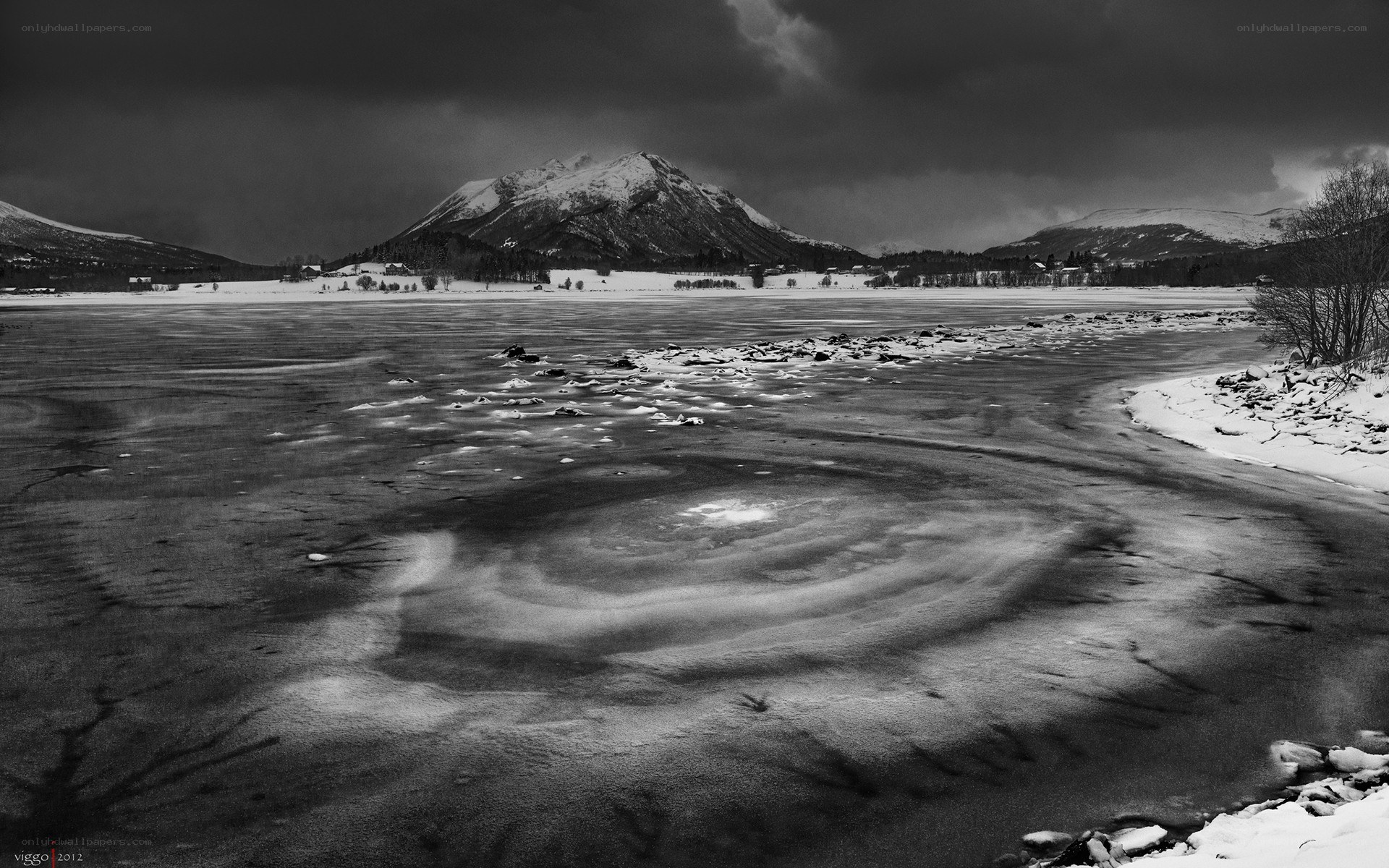 Frozen lake with mountain view