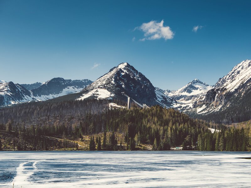 frozen lake with mountain view