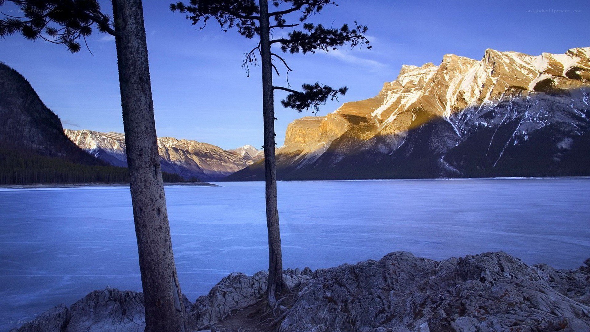 frozen lake with mountains