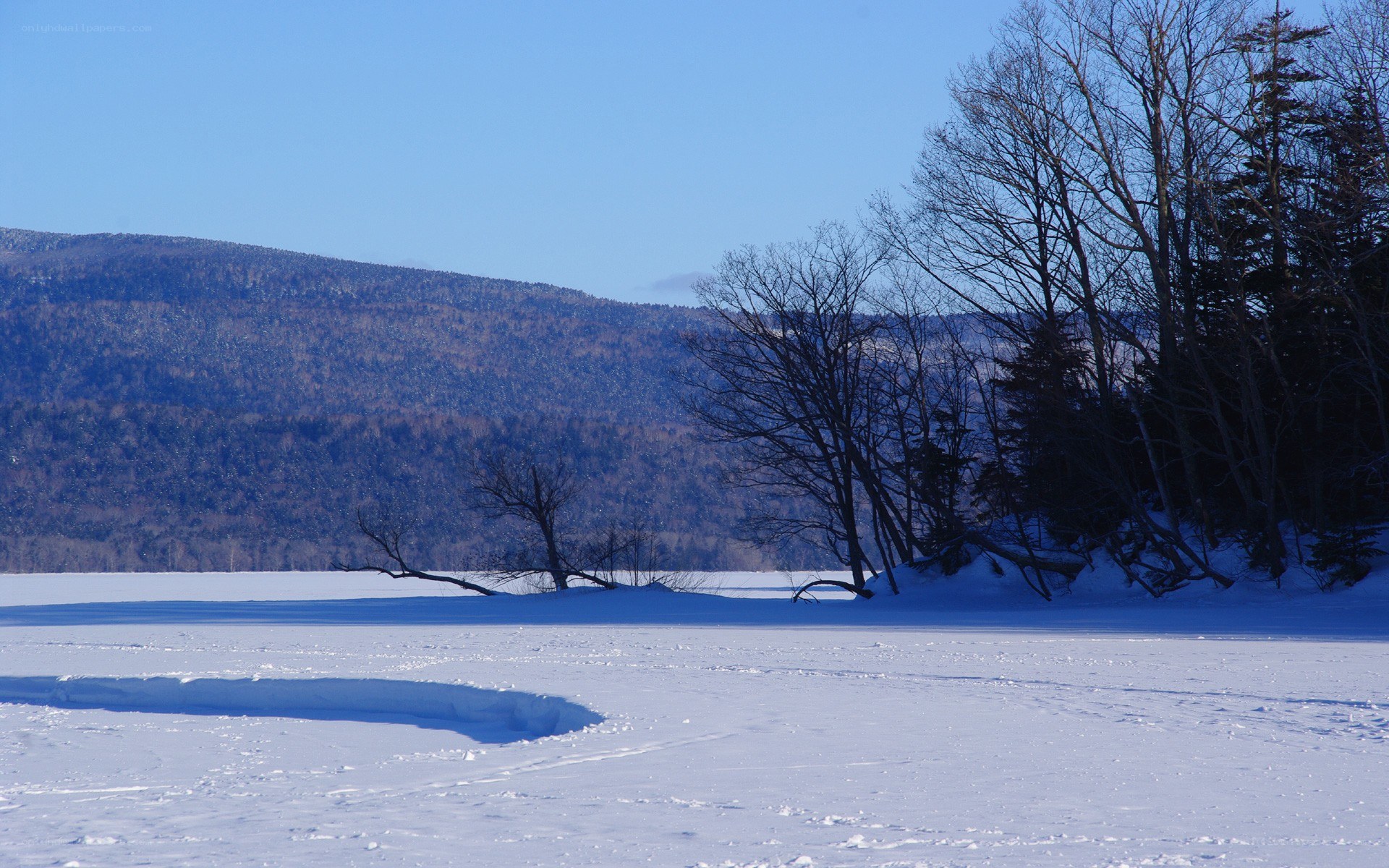 frozen lake with mountains