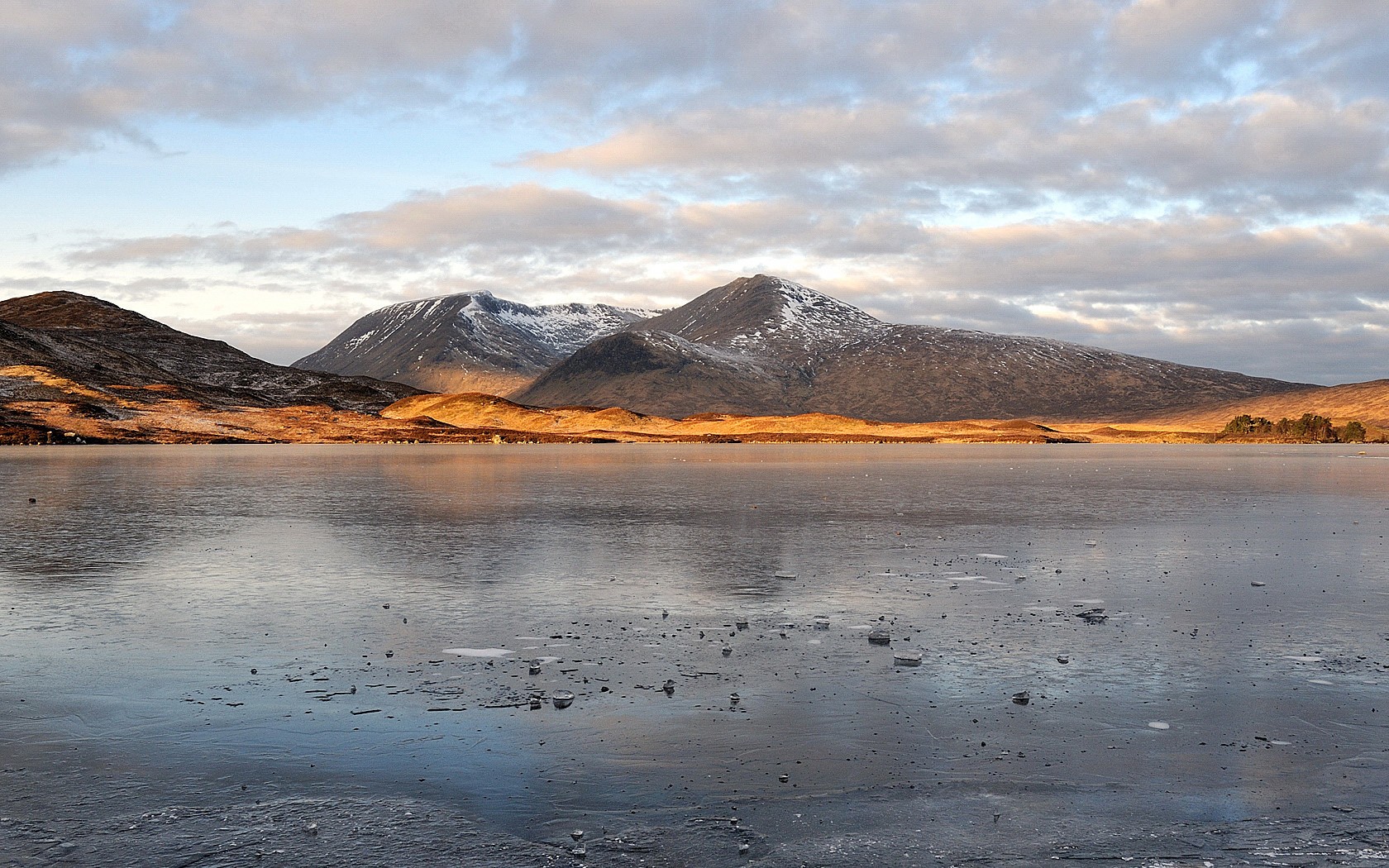 frozen lake with mountains