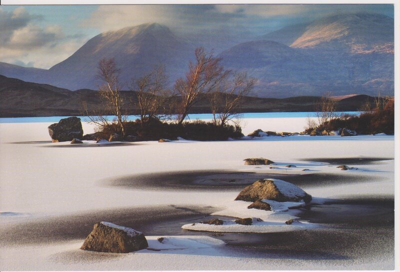 Frozen lake with mountains