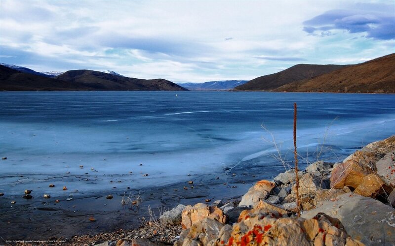 frozen lake with mountains