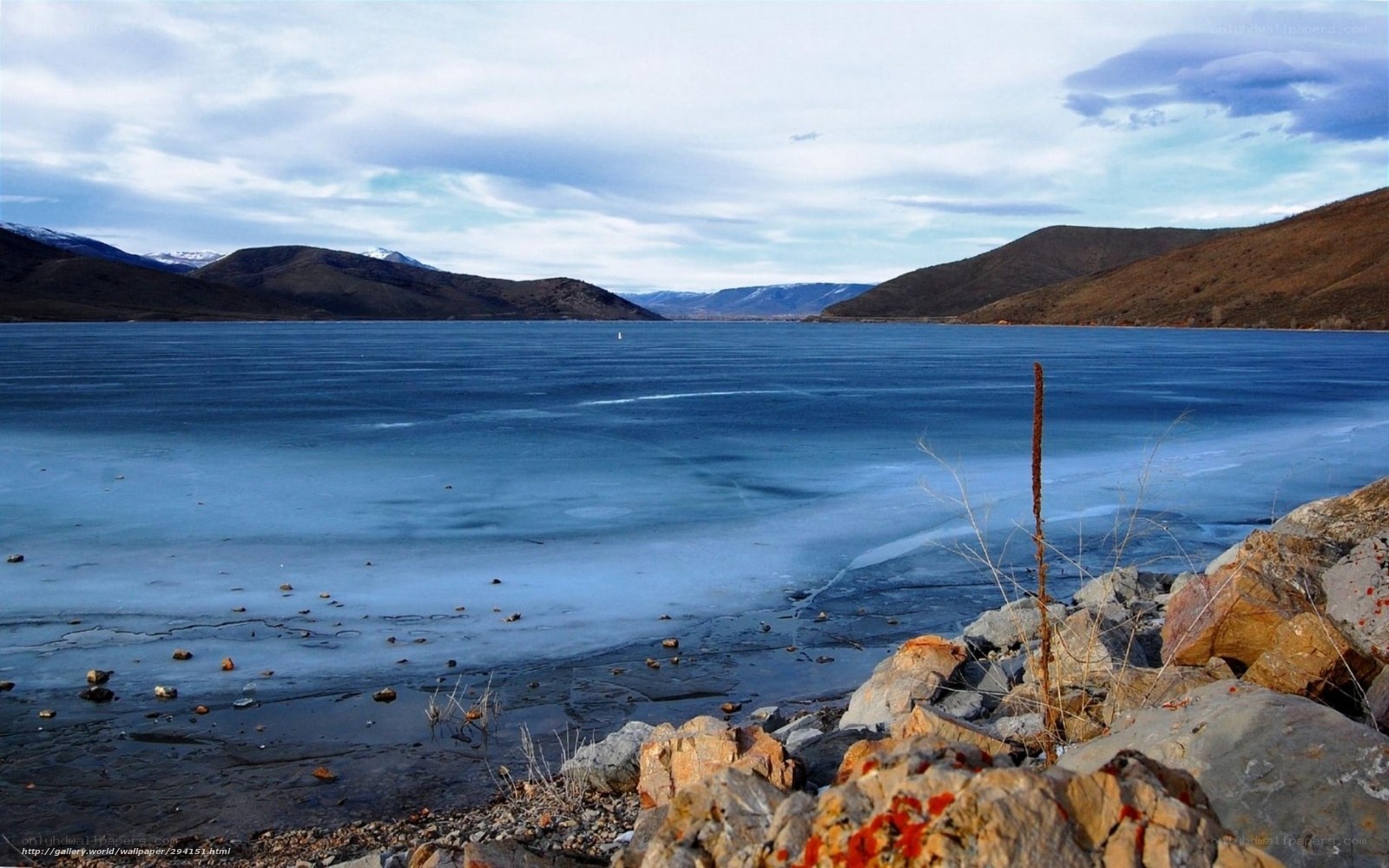 frozen lake with mountains