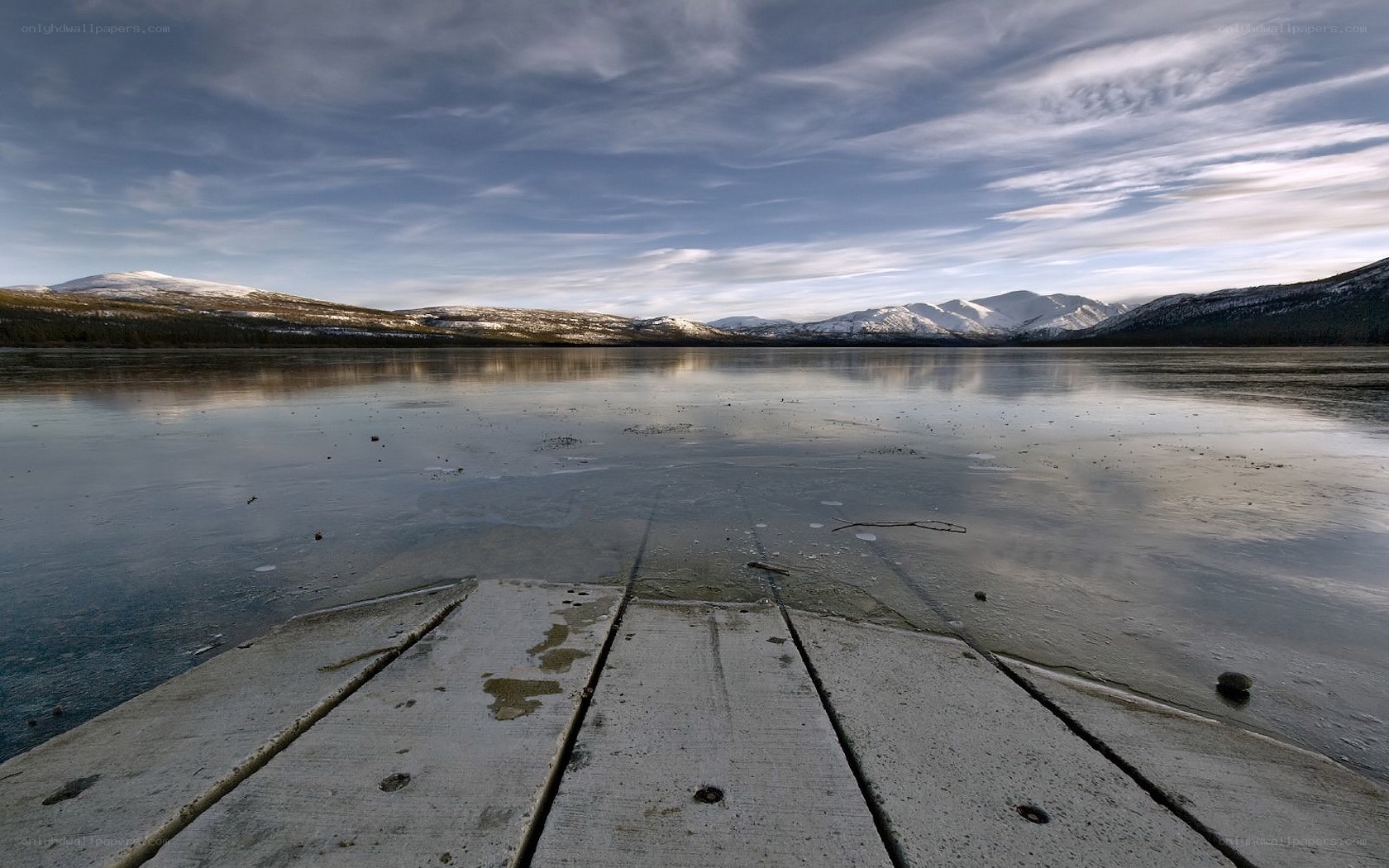 Frozen lake with mountains