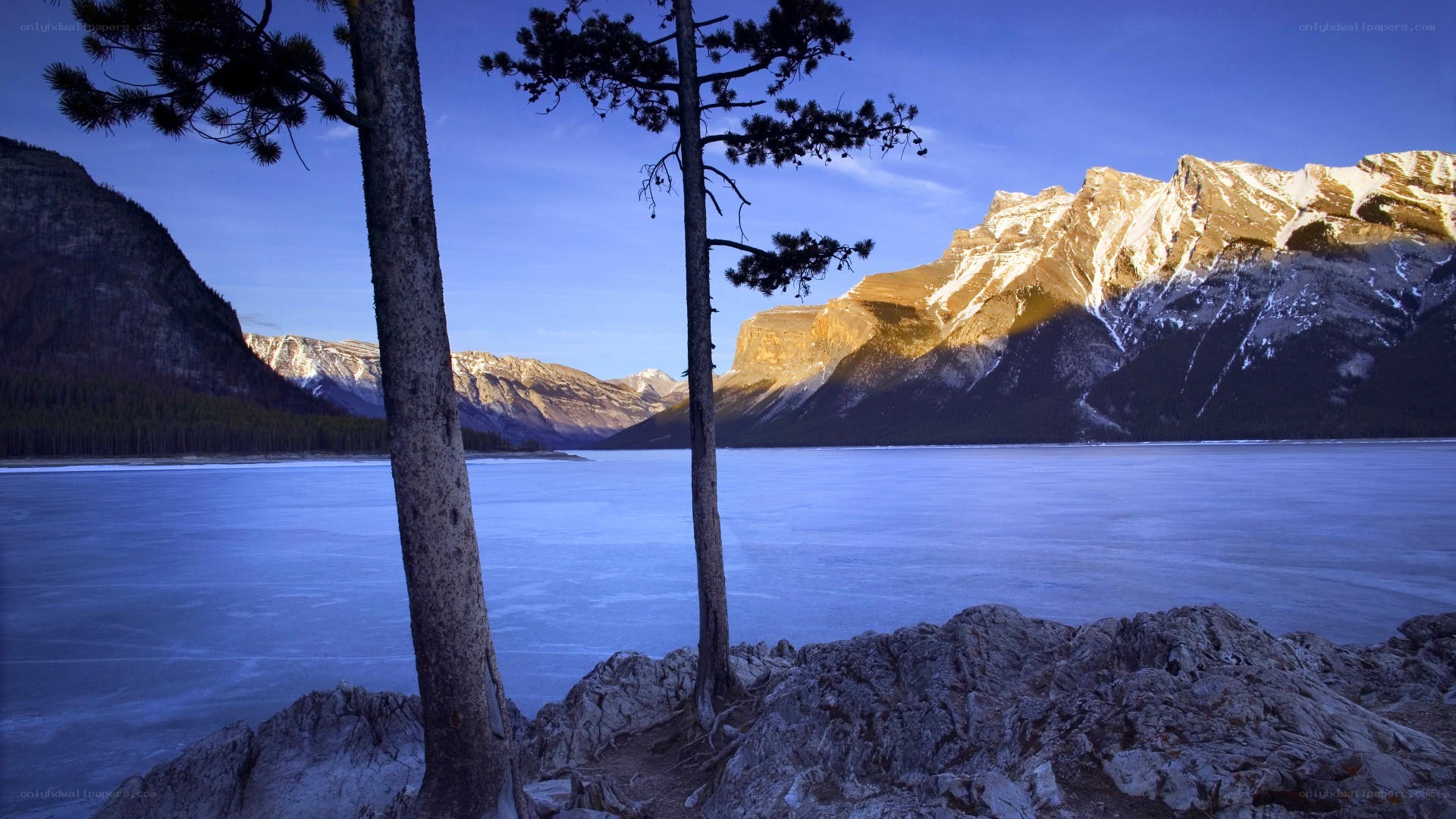 frozen lake with mountains