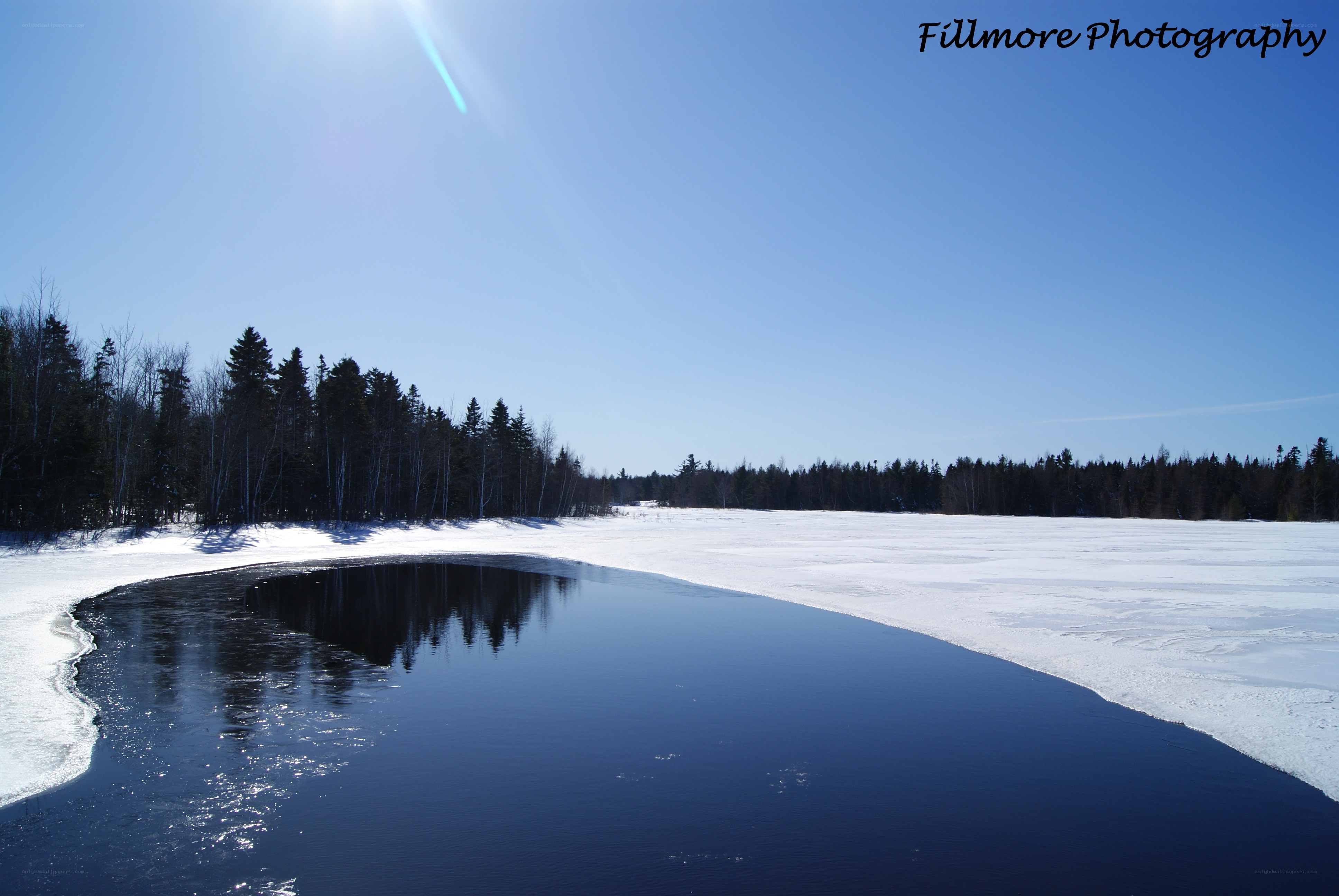 Frozen lake with open water
