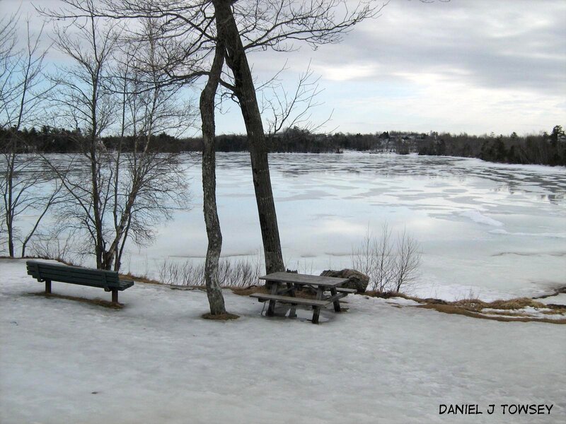 Frozen lake with picnic table