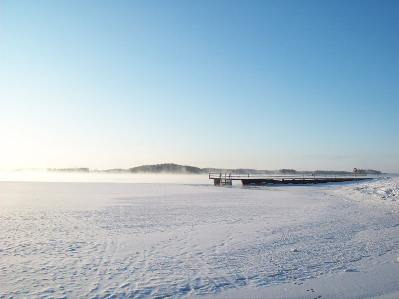 Frozen lake with pier