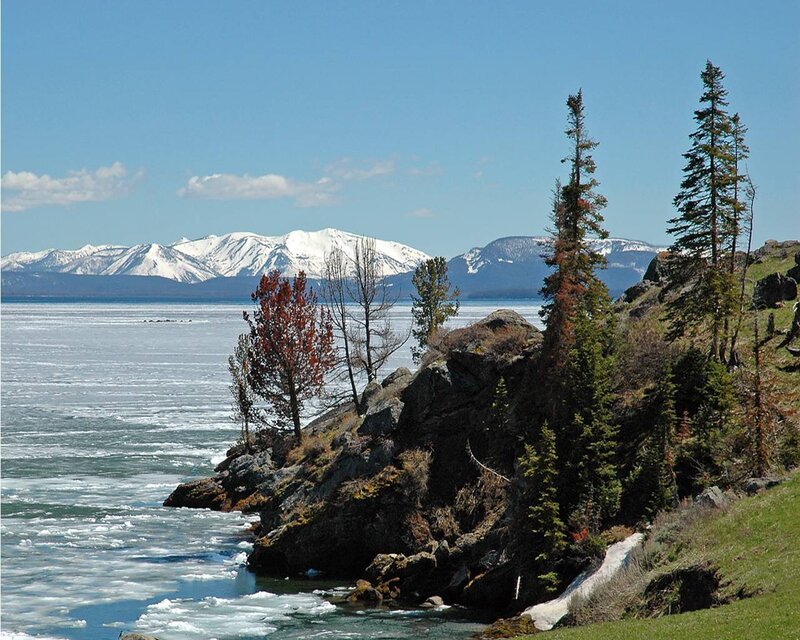 frozen lake with snow-capped mountains