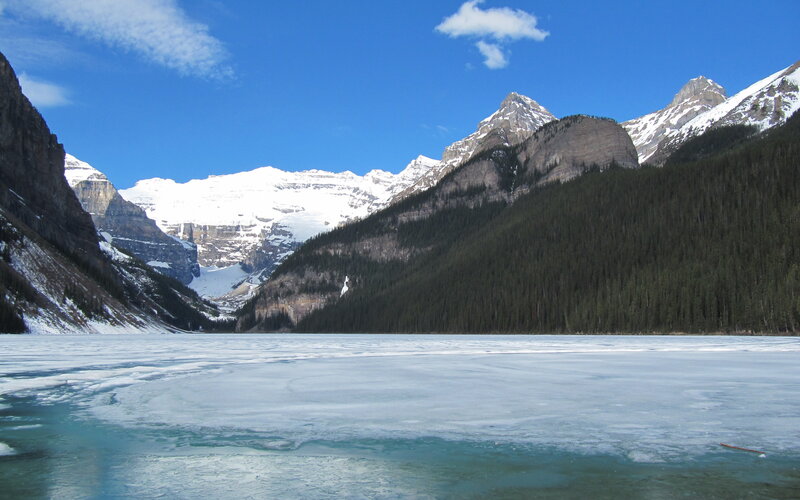 frozen lake with snow-capped mountains