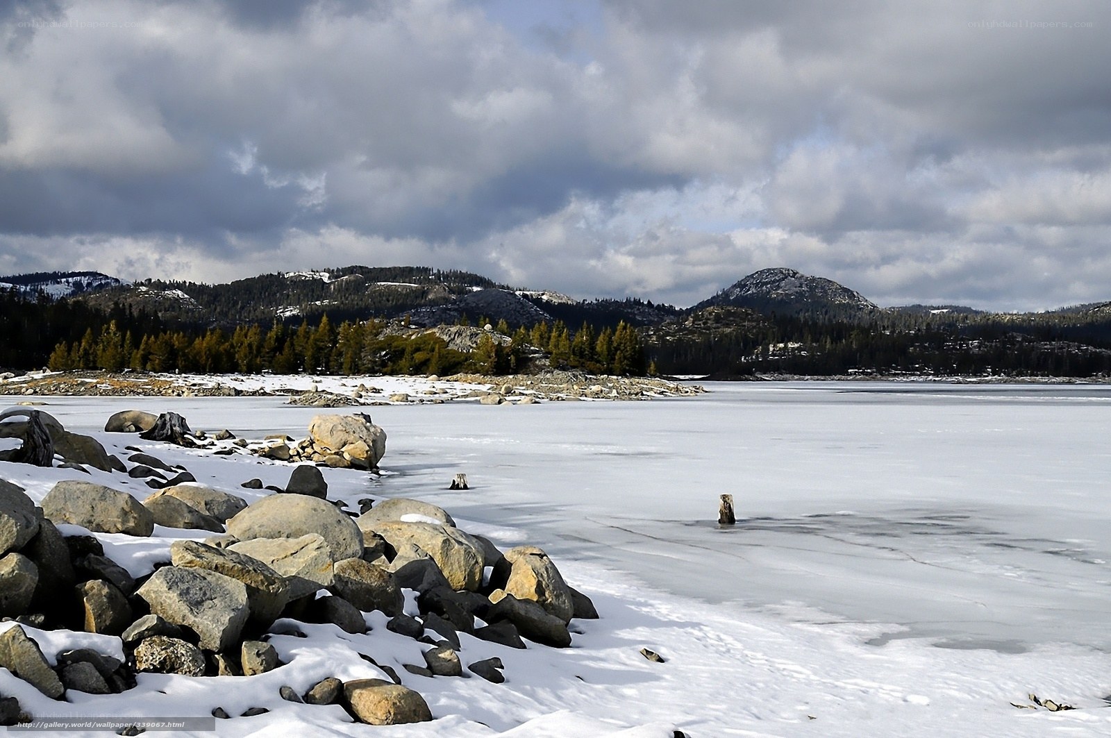 Frozen lake with snowy mountains