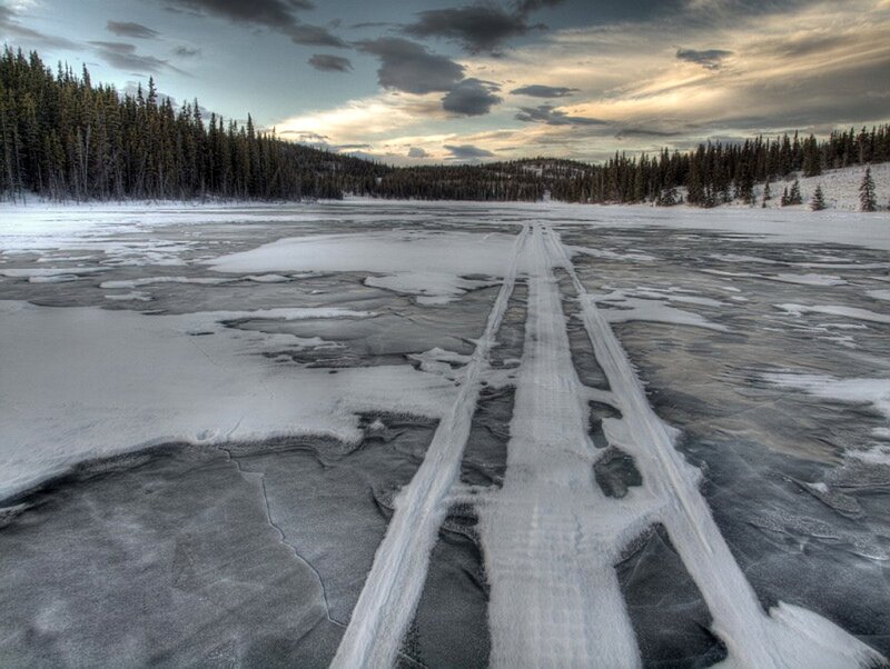 Frozen lake with tire tracks