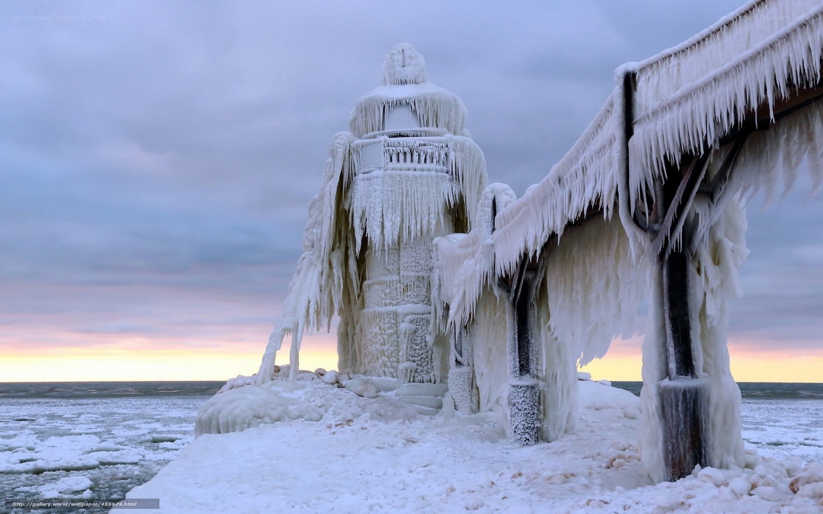 Frozen lighthouse at sunset