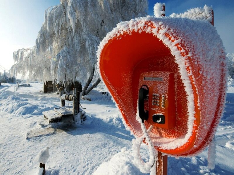 frozen phone booth in winter