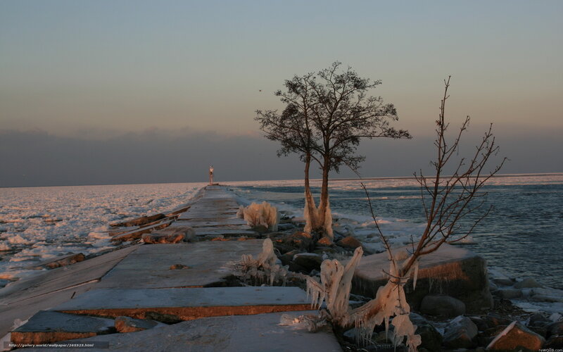 Frozen pier at sunset