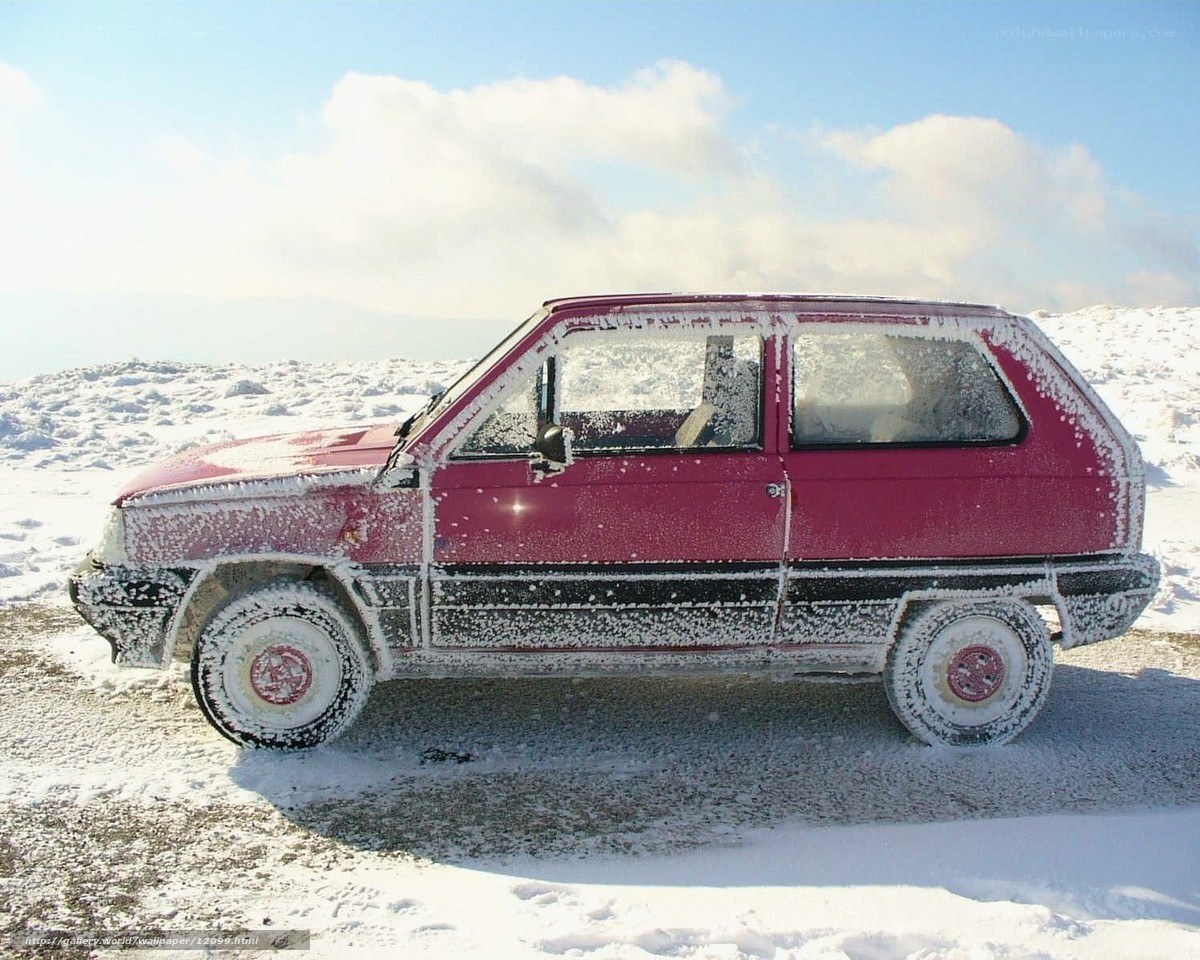 frozen red car in snow