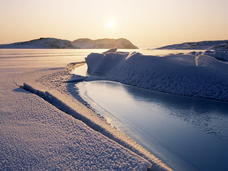 Frozen river at sunset