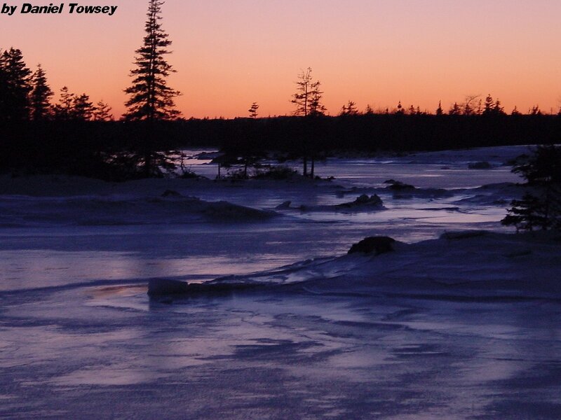frozen river at sunset