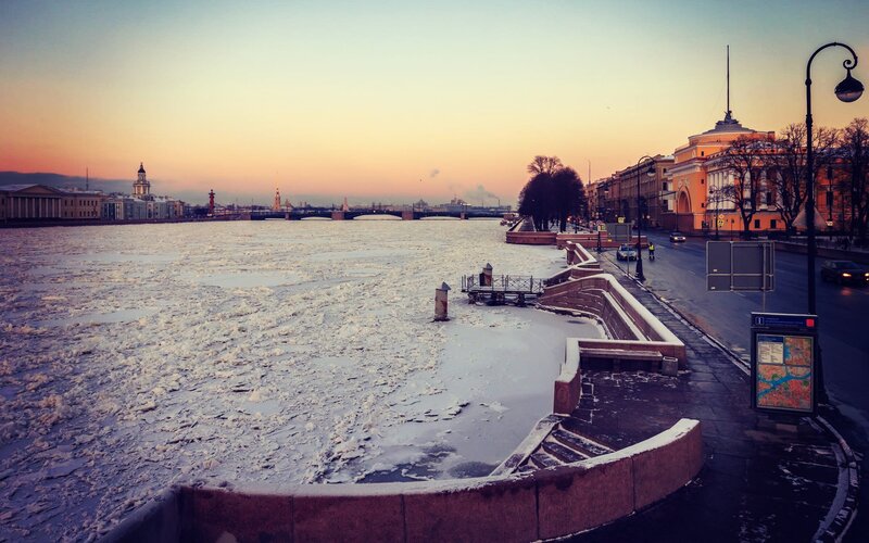 Frozen River at Sunset — Orange, Serene, Photograph, Buildings