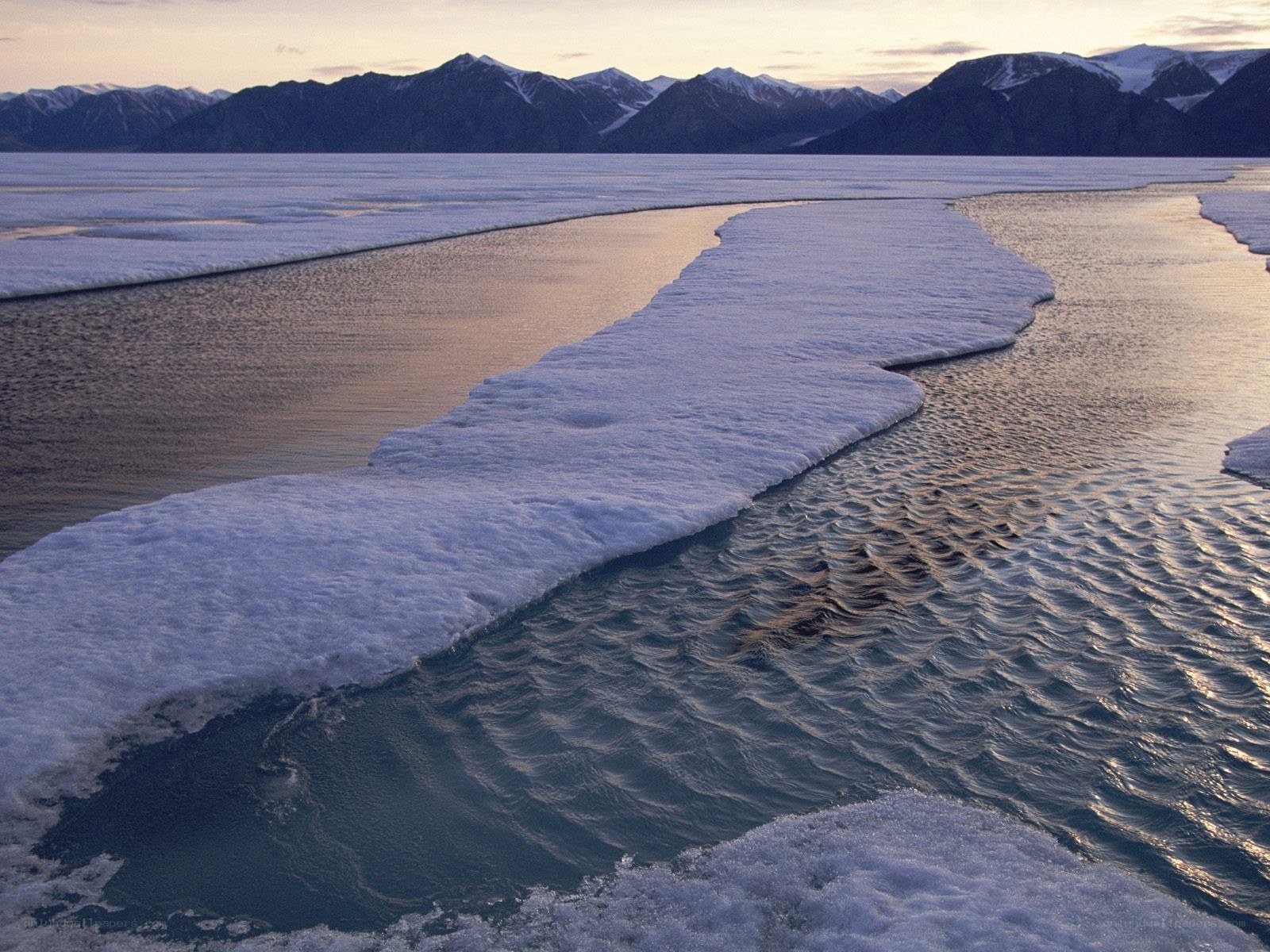 Frozen river in mountain landscape