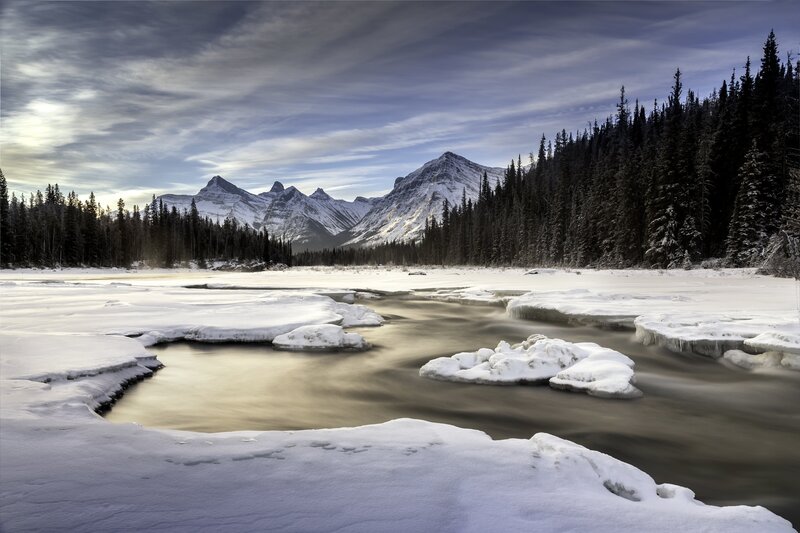 Frozen River in Mountains — White, Serene, Winter