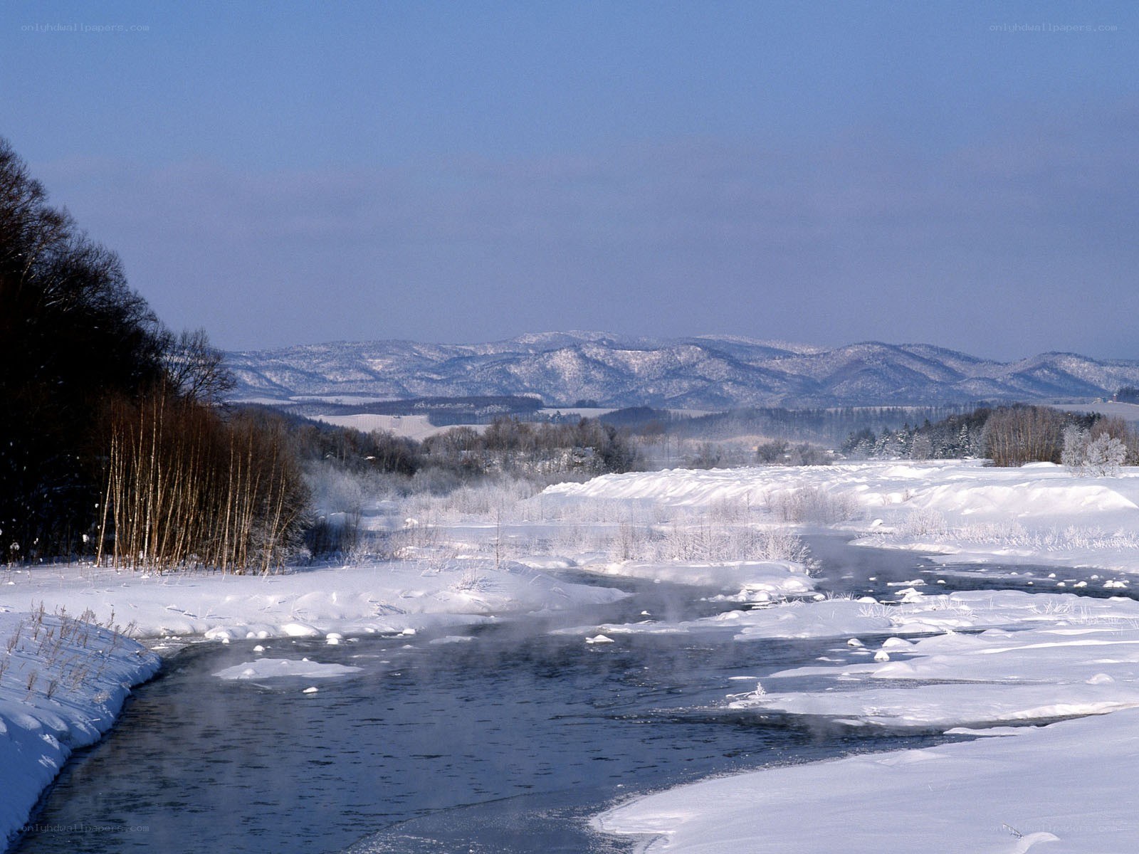Frozen river in winter landscape
