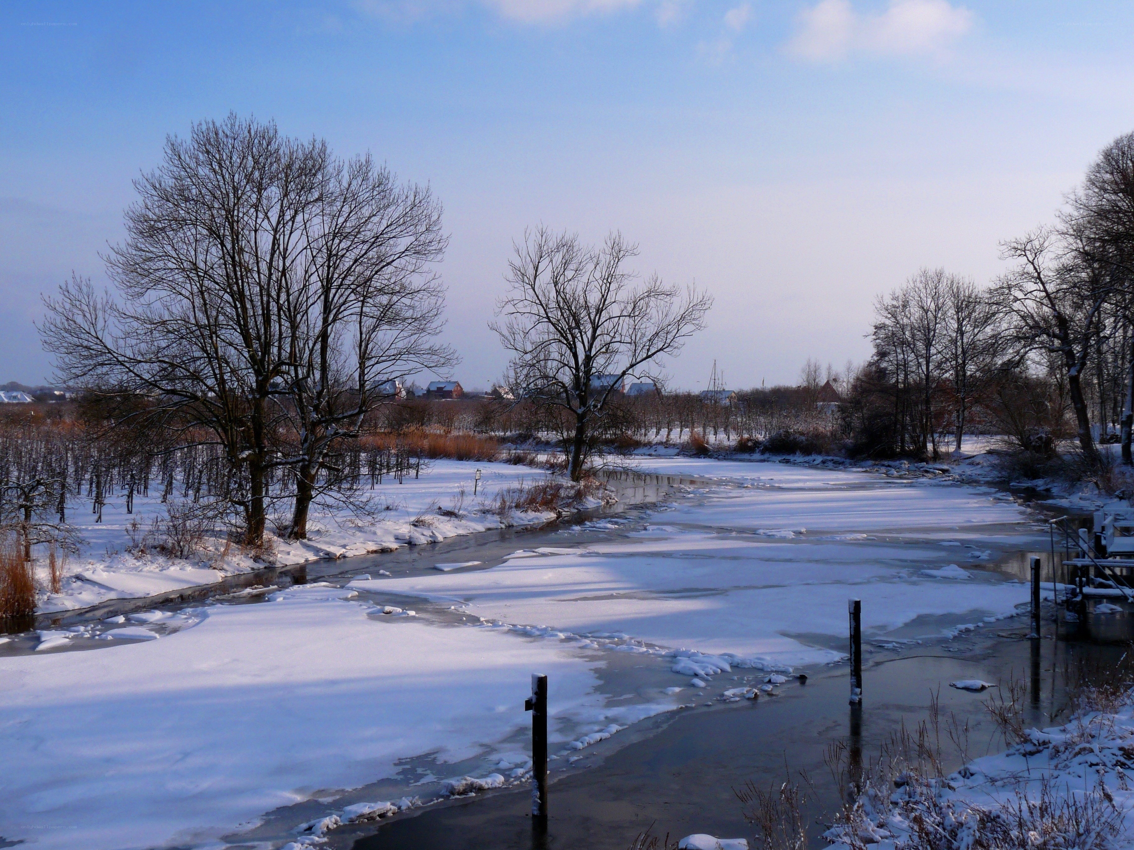 Frozen river in winter landscape