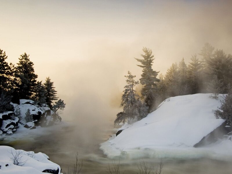 frozen river in winter mist