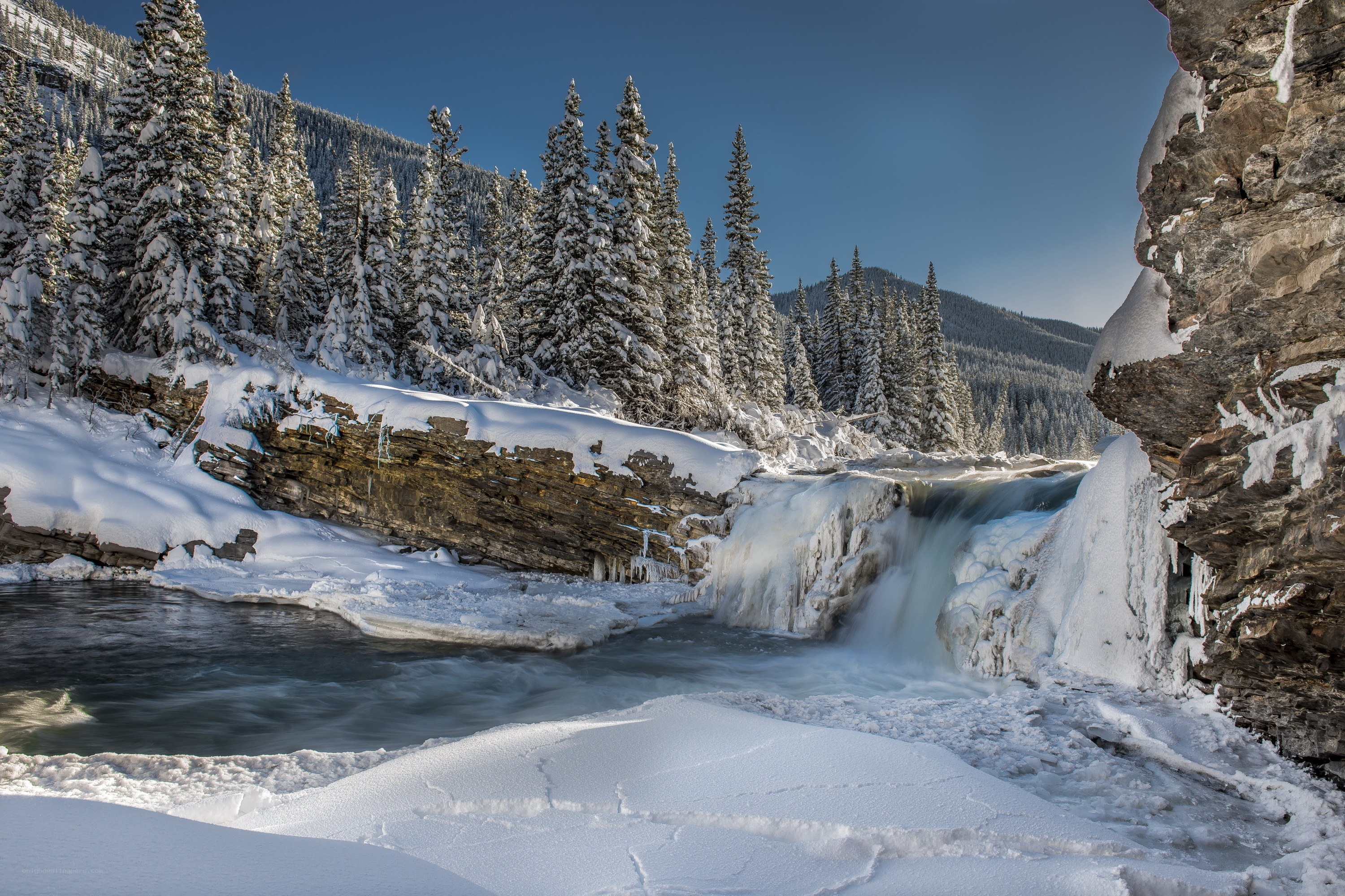 Frozen river waterfall in winter