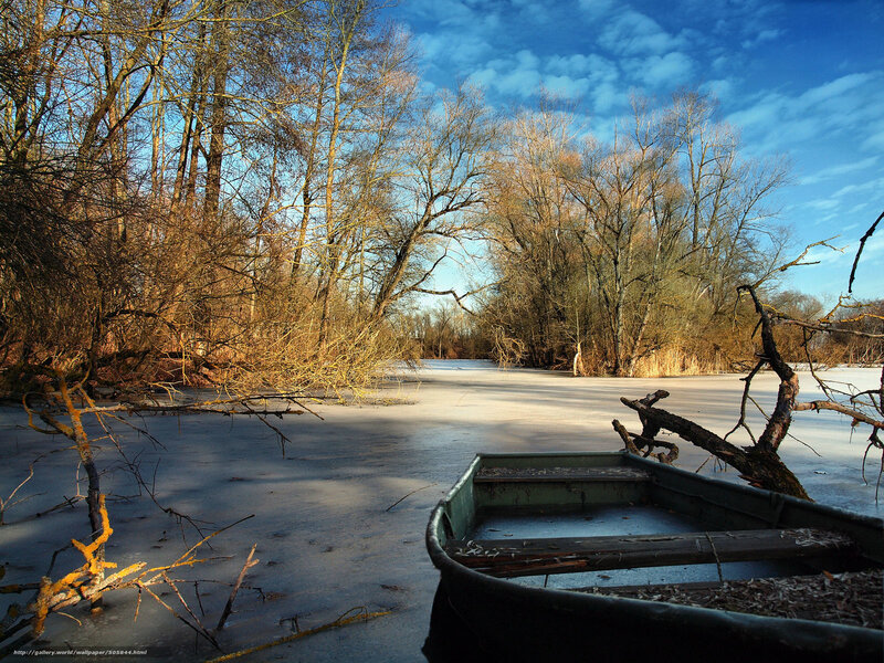 Frozen river with boat