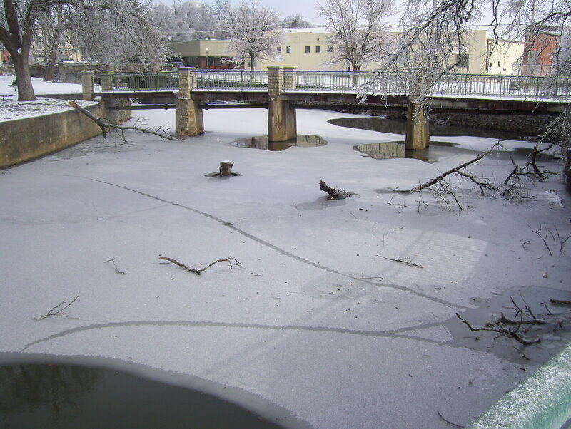 Frozen river with bridge