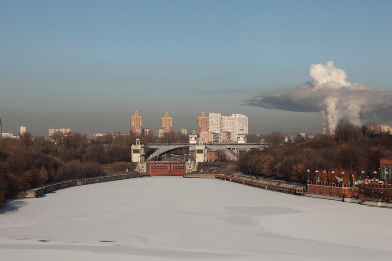 Frozen river with city skyline