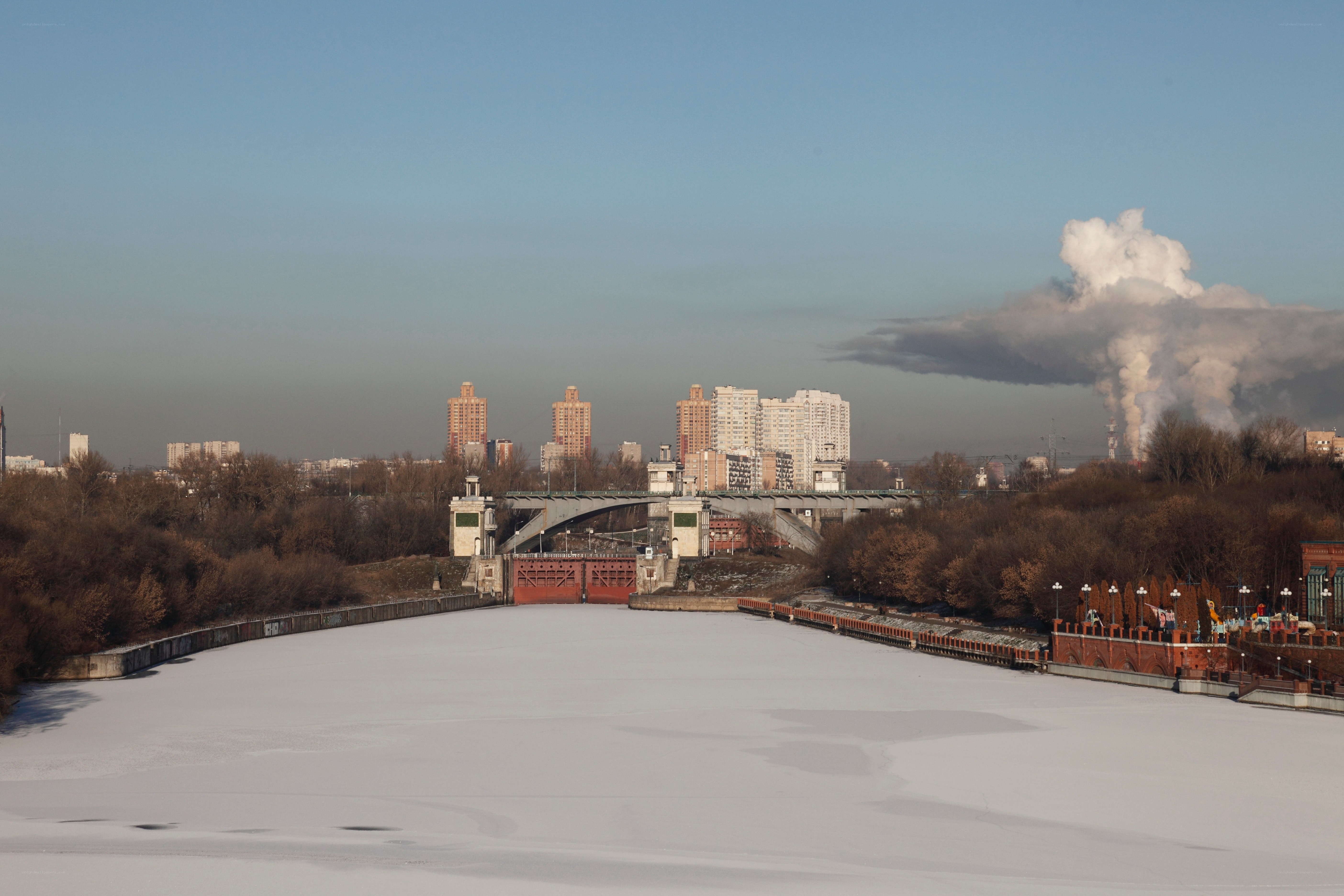 Frozen river with city skyline