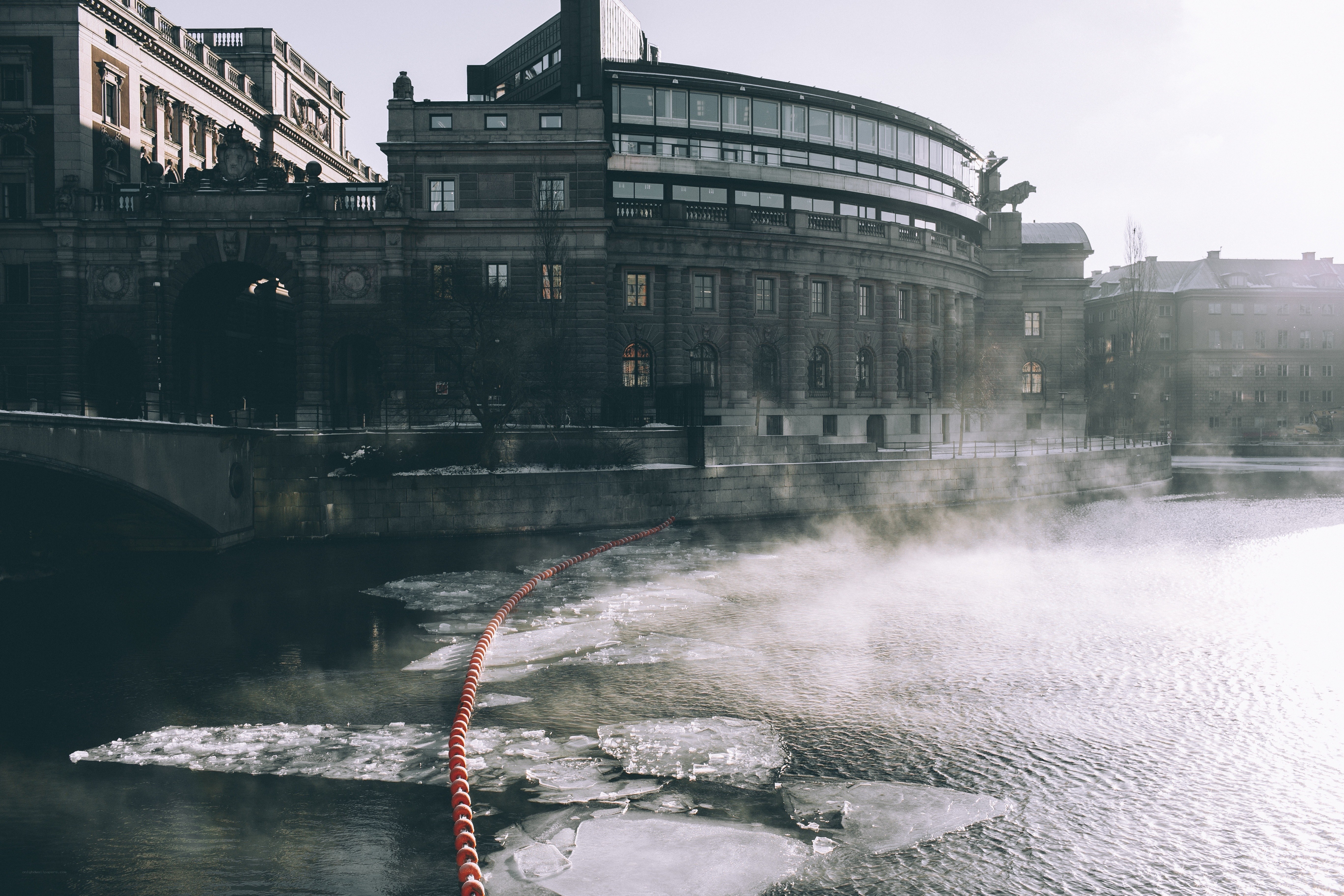 Frozen river with historic buildings